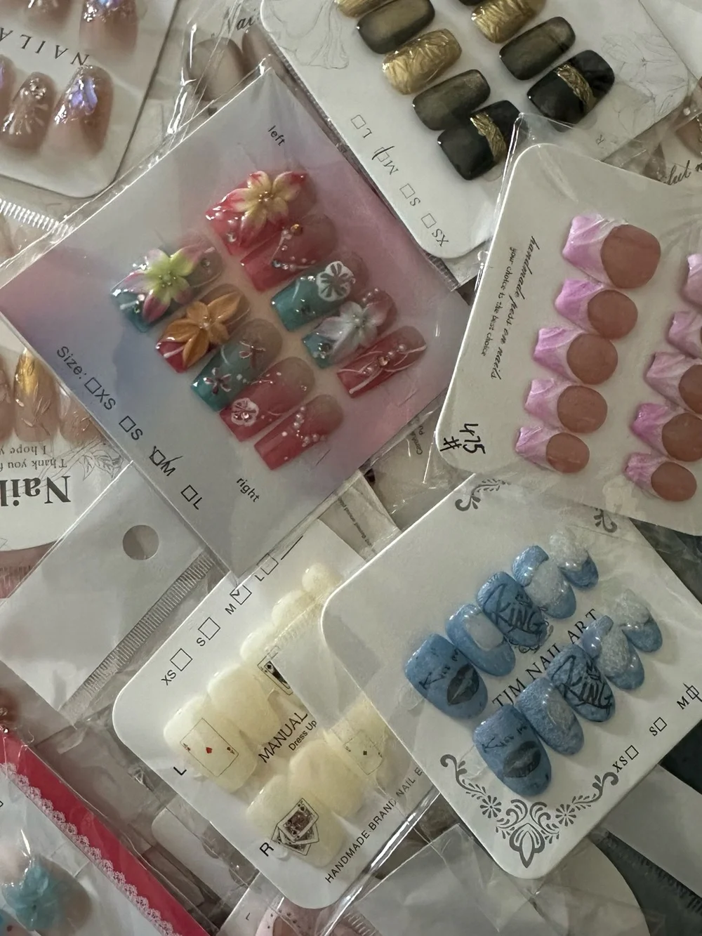 100 Sets of SURPRISE Assorted Press-On Nail Sets - Floral, Pink, Blue, Neutral